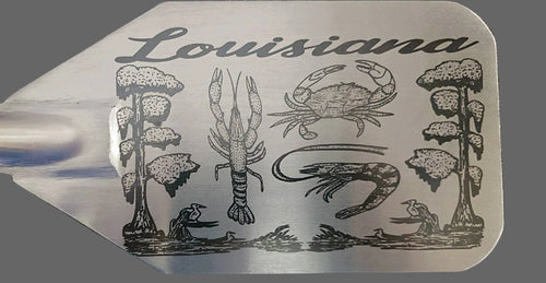 Crawfish paddle with Louisiana-themed illustrations, including a crawfish, crab, and trees on a stainless steel background.
